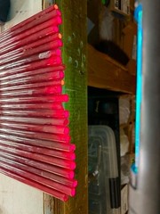 Sticks of Ruby Red neon glass tubing
