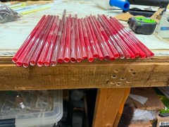 Sticks of Ruby Red neon glass tubing