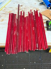 Sticks of Ruby Red neon glass tubing